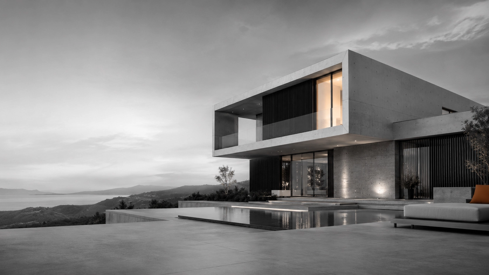Vivienda contemporánea de líneas puras proyectada por D.Seña Arquitectura, con voladizo y grandes vidrios sobre el paisaje.